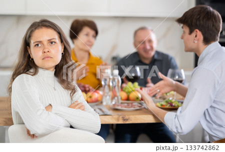 Offended girl turned away from her family during holiday dinner with her parents at home 133742862
