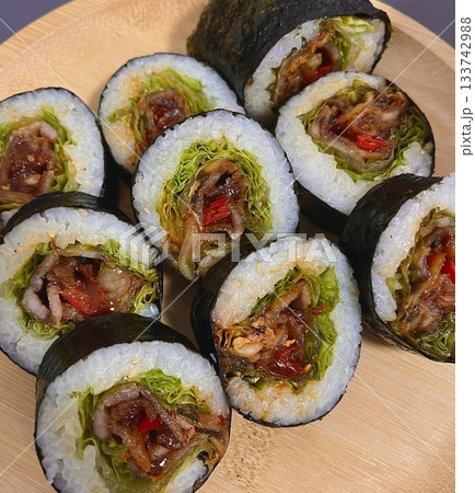Delicious kimbap rolls filled with fresh vegetables, seasoned rice, and savory proteins, all wrapped in crisp seaweed. A perfect combination of flavor and texture in every bite. Delicious kimbap rolls filled with fresh vegetables, seasoned rice, and savory proteins, all wrapped in crisp seaweed. A perfect combination of flavor and texture in every bite. 133742988
