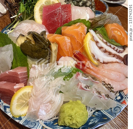 Fresh and delicate sashimi slices, beautifully presented with vibrant colors and perfect cuts. This traditional Japanese delicacy highlights the pure flavors of premium seafood. Fresh and delicate sashimi slices, beautifully presented with vibrant colors and perfect cuts. This traditional Japanese delicacy highlights the pure flavors of premium seafood. 133743291