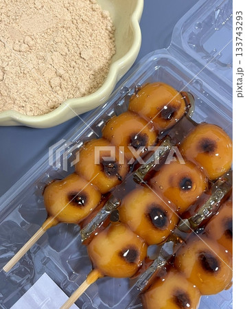 Mitarashi dango, skewered rice dumplings glazed with a sweet soy sauce syrup, offering a delightful balance of sweetness and umami. A classic Japanese snack perfect for any occasion. 133743293