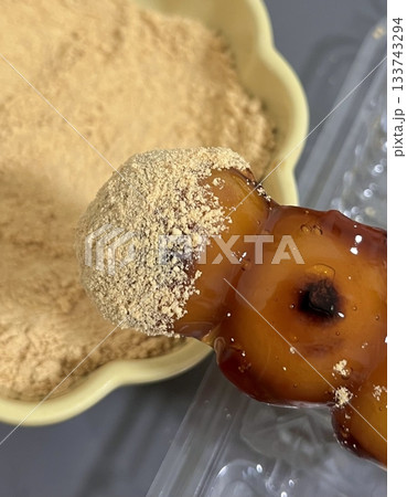 Mitarashi dango, skewered rice dumplings glazed with a sweet soy sauce syrup, offering a delightful balance of sweetness and umami. A classic Japanese snack perfect for any occasion. 133743294