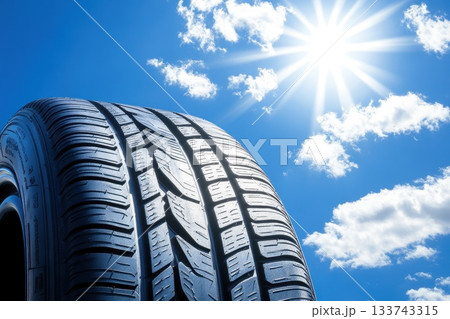 A tire is shown with the sun shining on it 133743315