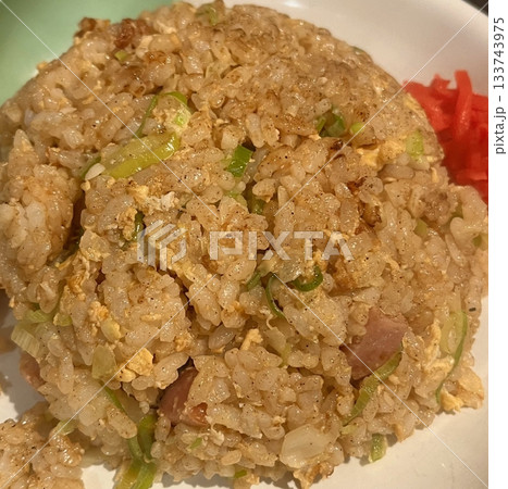 nasi goreng or fried rice traditional frying rice dish from indonesia made of Precooked rice fried in a small amount of oil, then spiced up with shallots, garlic, chili and sweet soy sauce. nasi goreng or fried rice traditional frying rice dish from indonesia made of Precooked rice fried in a small amount of oil, then spiced up with shallots, garlic, chili and sweet soy sauce. 133743975