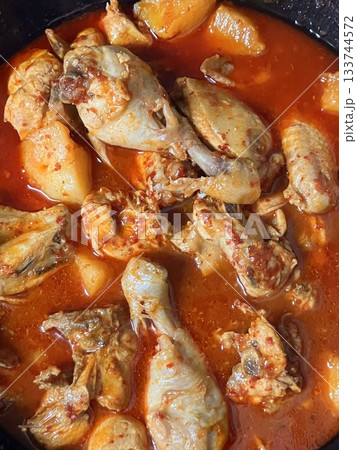 Spicy and hearty dakbokkeumtang with tender chicken, potatoes, and vegetables in rich red sauce. Perfect for Korean cuisine menus, food blogs, and traditional comfort food features! 133744572