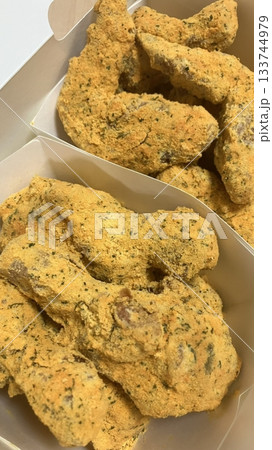 Crispy fried chicken with golden, crunchy skin and juicy, tender meat. A delicious and savory dish, perfect for any meal, served with dipping sauces or side dishes for extra flavor! 133744979