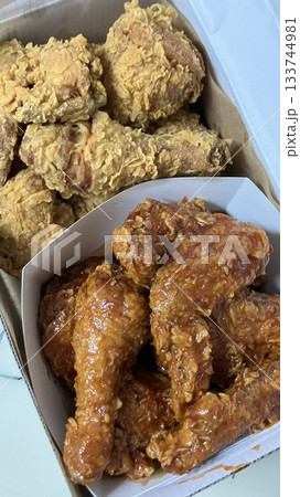 Crispy fried chicken with golden, crunchy skin and juicy, tender meat. A delicious and savory dish, perfect for any meal, served with dipping sauces or side dishes for extra flavor! Crispy fried chicken with golden, crunchy skin and juicy, tender meat. A delicious and savory dish, perfect for any meal, served with dipping sauces or side dishes for extra flavor! 133744981