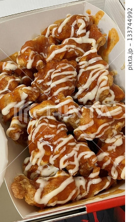 Crispy fried chicken with golden, crunchy skin and juicy, tender meat. A delicious and savory dish, perfect for any meal, served with dipping sauces or side dishes for extra flavor! 133744992