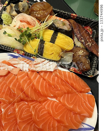 Fresh and delicate sashimi slices, beautifully presented with vibrant colors and perfect cuts. This traditional Japanese delicacy highlights the pure flavors of premium seafood. Fresh and delicate sashimi slices, beautifully presented with vibrant colors and perfect cuts. This traditional Japanese delicacy highlights the pure flavors of premium seafood. 133744996