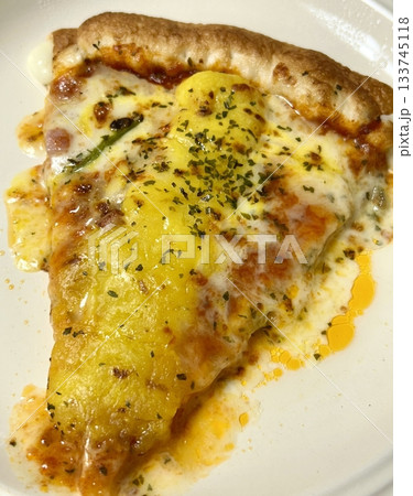 Hot and cheesy pizza slice with a crispy crust and savory toppings. A perfect mix of melty goodness and bold flavor for a satisfying comfort food favorite. Hot and cheesy pizza slice with a crispy crust and savory toppings. A perfect mix of melty goodness and bold flavor for a satisfying comfort food favorite. 133745118