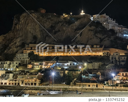 village perched on hill illuminated, hilltop village at night with glowing terraces and warm lights village perched on hill illuminated, hilltop village at night with glowing terraces and warm lights 133745232