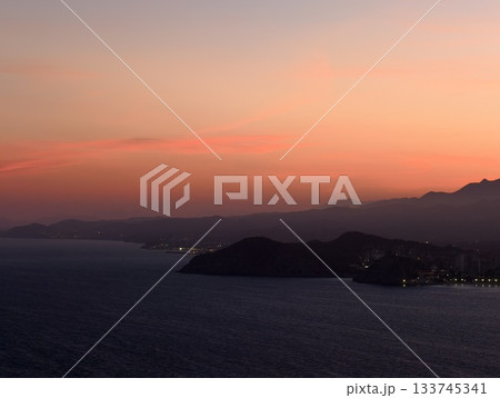 sunset paints coast with gentle hues, romantic twilight decorates coastal scene with pastel shades 133745341
