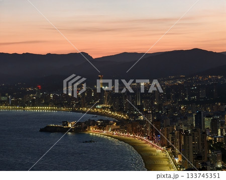 sunset coastal walk, golden hour seaside promenade illuminated with gentle waves and vibrant sunset coastal walk, golden hour seaside promenade illuminated with gentle waves and vibrant 133745351