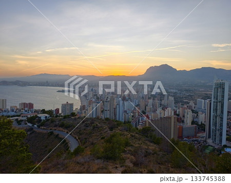 scenic coastal investment view, stunning golden hour scene showcasing residential towers by bay scenic coastal investment view, stunning golden hour scene showcasing residential towers by bay 133745388