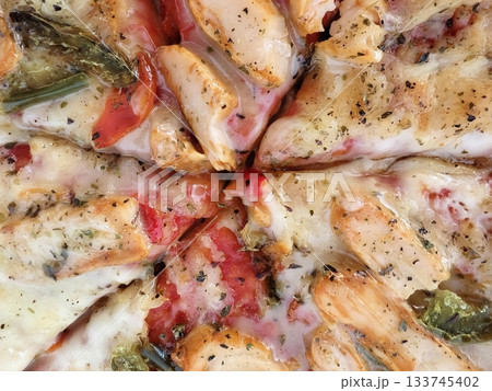 closeup of chicken pizza with fresh herbs, delicious chicken pizza slices with herbs and melted closeup of chicken pizza with fresh herbs, delicious chicken pizza slices with herbs and melted 133745402