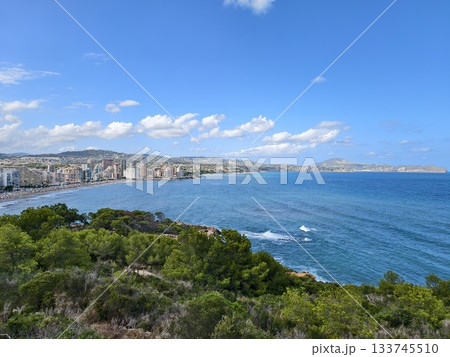 breathtaking seaside view of town and coast, picturesque beach scene overlooking town and distant breathtaking seaside view of town and coast, picturesque beach scene overlooking town and distant 133745510
