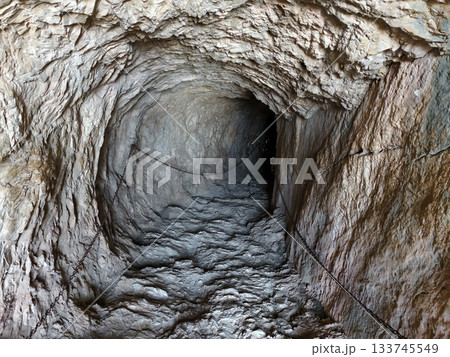 echoing tunnel with wartime traces, defensive remnants and silent echoes in narrow bunker tunnel echoing tunnel with wartime traces, defensive remnants and silent echoes in narrow bunker tunnel 133745549