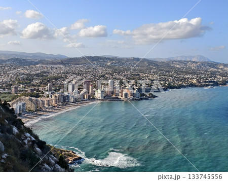 charming bay with town and beach, stunning scenic view of coastal bay featuring town and sandy 133745556