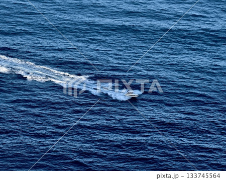 patrol boat at sea, vigilant patrol boat navigating ocean, quickmoving patrol vessel leaves wake patrol boat at sea, vigilant patrol boat navigating ocean, quickmoving patrol vessel leaves wake 133745564
