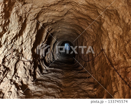 rock walls layers, fieldwork examination of stratified mineral patterns on rocky tunnel surfaces 133745574