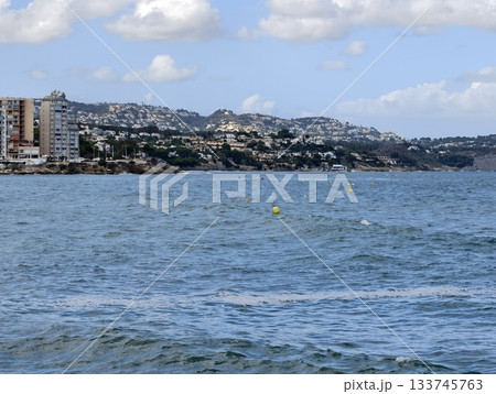 seaside urban scene, coastal cityscape with waves, highrise buildings over choppy seascape and hills seaside urban scene, coastal cityscape with waves, highrise buildings over choppy seascape and hills 133745763