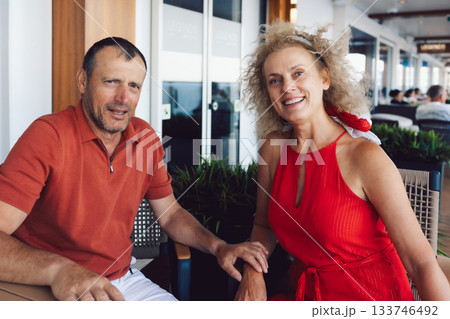 Married couple on cruise ship. Attractive couple on deck with cruise ship. High quality photo 133746492
