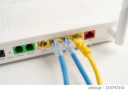 Ethernet cable with wireless router connect to internet service provider internet network. Ethernet cable with wireless router connect to internet service provider internet network. 133747232