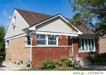 Suburb exterior with private housing. Suburban neighborhood. Private family home architecture. House exterior. Private house in suburban area. Suburban house architecture. Residential privacy Suburb exterior with private housing. Suburban neighborhood. Private family home architecture. House exterior. Private house in suburban area. Suburban house architecture. Residential privacy 133748270