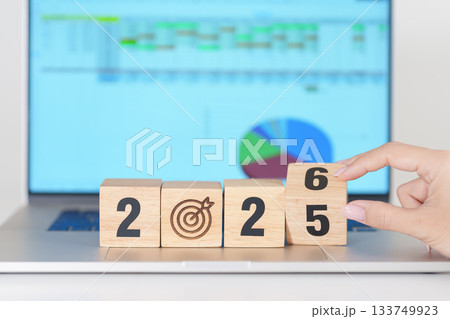 2025 end year to Happy New Year 2026 block with dartboard icon against computer laptop background. Goal, Target, Resolution, strategy, plan, Action, mission, motivation, and New Year start concepts 133749923