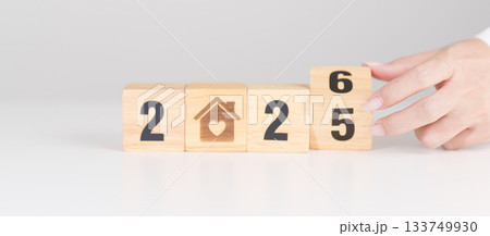 2025 end year to Happy New Year 2026 with Home and Heart block. Property investment, House Mortgage, Real Estate tax, homeless, donation, Financial and happy family concepts 133749930