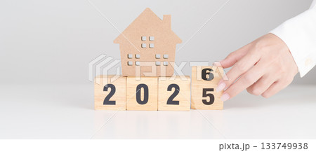 2025 end year to Happy New Year 2026 with house model. real estate, Home loan and mortgage, tax, investment, financial, savings and New Year Resolution concepts 2025 end year to Happy New Year 2026 with house model. real estate, Home loan and mortgage, tax, investment, financial, savings and New Year Resolution concepts 133749938