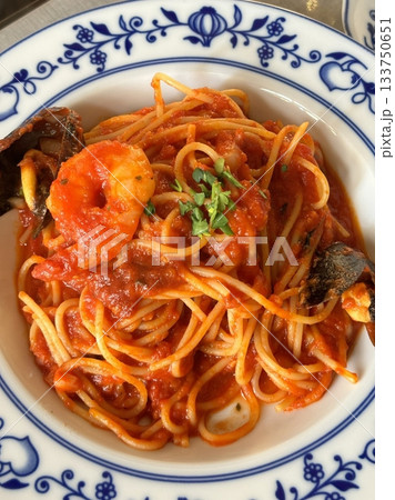 Classic spaghetti coated in rich tomato sauce, offering a simple yet delicious combination of tangy, savory flavors perfect for a comforting meal. Classic spaghetti coated in rich tomato sauce, offering a simple yet delicious combination of tangy, savory flavors perfect for a comforting meal. 133750651
