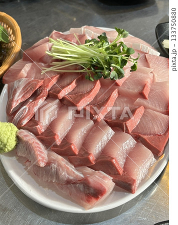 Fresh and buttery yellowtail sashimi (bangeo) with a rich, melt-in-your-mouth texture, offering a perfect balance of clean flavors and delicate sweetness in every luxurious bite. 133750880