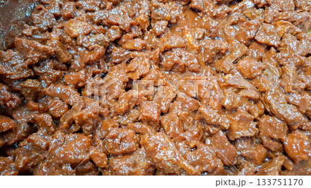 Simmering Beef Rendang Nearing Reduction Point Sauce Thickening and Darkening Simmering Beef Rendang Nearing Reduction Point Sauce Thickening and Darkening 133751170