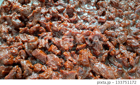 Overhead View of Tender Beef Rendang Chunks Deep Brown Color and Sheen Overhead View of Tender Beef Rendang Chunks Deep Brown Color and Sheen 133751172