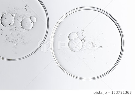 The texture of a cosmetic serum or body gel in a Petri dish. The texture of a cosmetic serum or body gel in a Petri dish. 133751365
