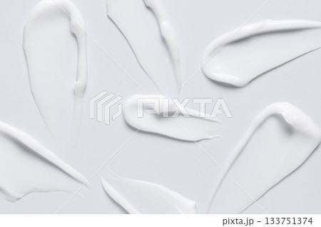 A sample of a white moisturizing cosmetic cream for the body or face with hyaluronic acid 133751374