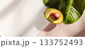 Close-up view of a perfectly ripe avocado half showcasing its smooth texture and vibrant colors 133752493