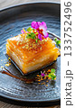 Delicate gourmet Eid dessert featuring vibrant colors and luxurious textures on a beautifully crafted plate 133752496
