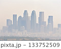 A dense haze hangs over the city skyline, a visual representation of the growing concern for air quality in urban environments. 133752509