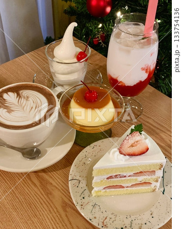 Light and creamy desserts with delicate layers, fresh fruits, and rich flavors, paired with refreshing sweet drinks. A perfect café treat for a delightful and indulgent experience. Light and creamy desserts with delicate layers, fresh fruits, and rich flavors, paired with refreshing sweet drinks. A perfect café treat for a delightful and indulgent experience. 133754136