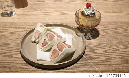 Light and creamy desserts with delicate layers, fresh fruits, and rich flavors, paired with refreshing sweet drinks. A perfect café treat for a delightful and indulgent experience. 133754143
