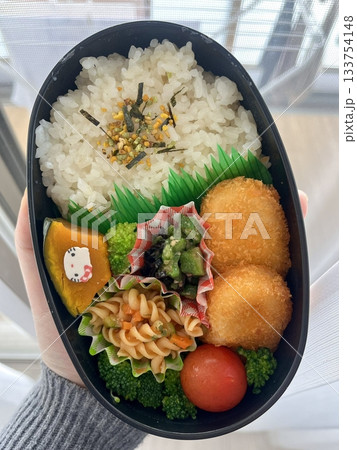 A traditional Korean dosirak, beautifully arranged with rice, assorted banchan, and savory proteins. Balanced and visually inviting, it’s a portable meal packed with vibrant flavors. A traditional Korean dosirak, beautifully arranged with rice, assorted banchan, and savory proteins. Balanced and visually inviting, it’s a portable meal packed with vibrant flavors. 133754148