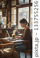 woman using tablet computer in coffee shop 133755256