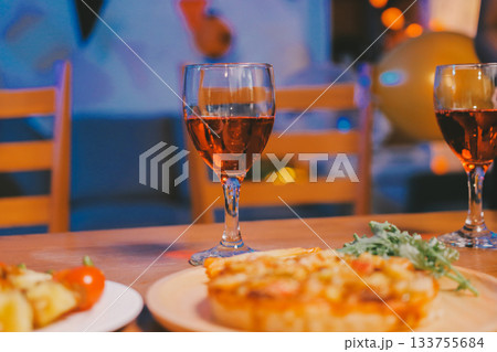 Joyful office Halloween party with coworkers in costumes, celebrating with drinks and laughter, fostering teamwork and festive spirit 133755684