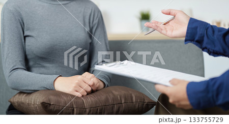 Mental Health Support. Therapist assisting a client in emotional distress during a counseling session. Mental Health Support. Therapist assisting a client in emotional distress during a counseling session. 133755729