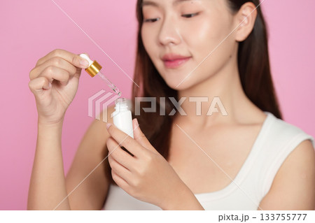 Skincare Routine: Woman Applying Serum for Healthy Skin 133755777