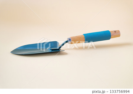 Gardening shovel on color background.Garden tool. Gardening shovel on color background.Garden tool. 133756994