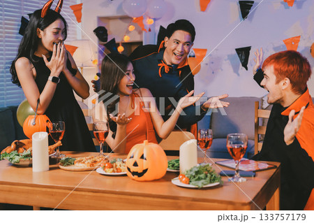 Joyful office Halloween party with coworkers in costumes, celebrating with drinks and laughter, fostering teamwork and festive spirit 133757179