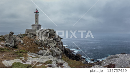 Majestic Lighthouse Overlooking the Rugged Coastline Majestic Lighthouse Overlooking the Rugged Coastline 133757429