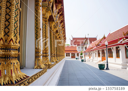 Thai temple walkway with ornate golden window columns at Wat Chana Songkhram, Bangkok Thai temple walkway with ornate golden window columns at Wat Chana Songkhram, Bangkok 133758189